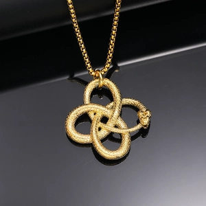 Macro detail of golden Ouroboros snake pendant with intricate scale texture and Celtic knot shape