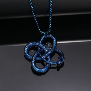 Close-up of blue plated stainless steel ouroboros snake pendant with scale texture