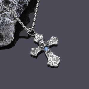 Gothic titanium steel necklace featuring a lava texture cross with skull and blue gem stone