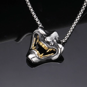 Gothic Hannya mask necklace for men featuring silver face with gold teeth and box chain