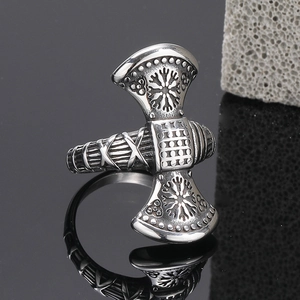 Silver Viking double axe ring with Nordic runes on black reflective background