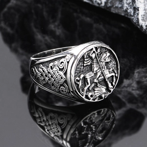Detailed macro view of the Saint George carving and Celtic knots on the silver punk ring