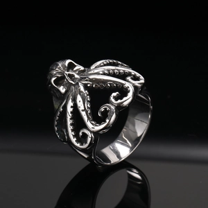Detailed close-up showing the intricate octopus suction cup textures on the vintage ring