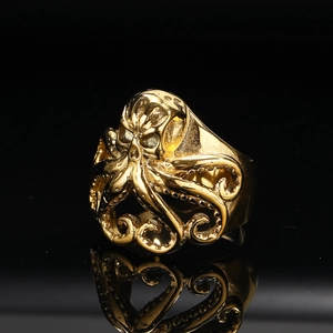 Detailed close-up of a punk style golden octopus skull ring with high metallic luster