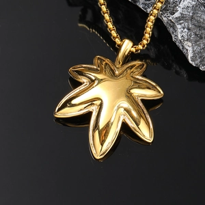 Polished gold maple leaf pendant in titanium steel with a sleek box chain for men