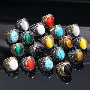 Retro punk titanium steel flame rings with assorted colorful gemstones on black mirror