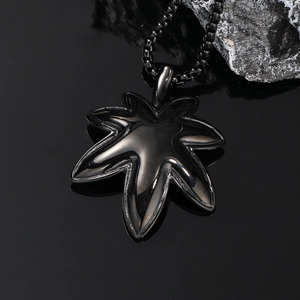 Polished black stainless steel maple leaf pendant necklace with sleek bead chain for men
