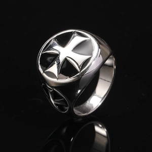 Detailed macro view of the black enamel Maltese Cross on the silver stainless steel signet ring