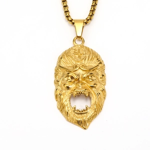 Close-up of golden Sun Wukong monkey mask pendant with intricate metal textures