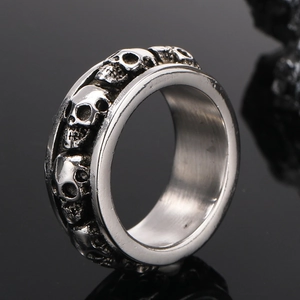 Retro punk gothic skull ring for men with detailed vintage silver carvings on black surface