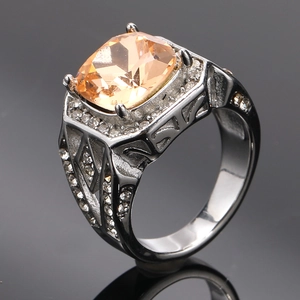 Macro detail of champagne cushion-cut gem with intricate geometric hollow band design