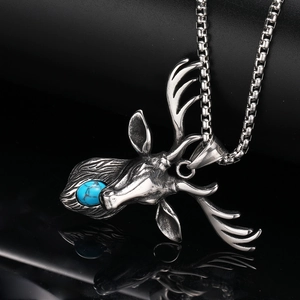 Retro stainless steel deer head necklace with blue stone inlay on black background