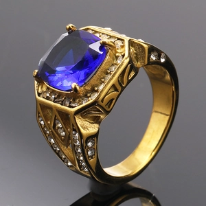 Detail of gold titanium ring with a large blue cushion-cut stone and micro-pave diamonds