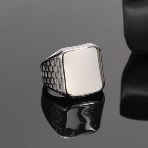 Polished silver titanium steel signet ring for men with honeycomb textured side details