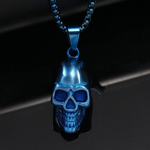 Detail of blue titanium steel skull pendant with brushed metallic texture on box chain