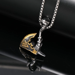 Vintage Viking axe pendant necklace in silver and gold steel on black mirror background