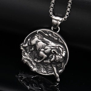 Macro detail of bull relief pendant with industrial texture and box chain