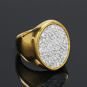 Hip hop style gold plated signet ring with micro paved clear crystals on oval surface