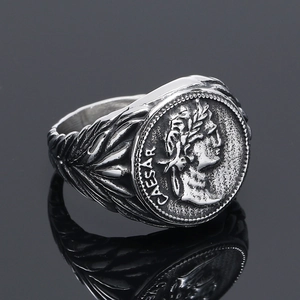 Detailed macro view of vintage Caesar portrait relief on silver stainless steel ring