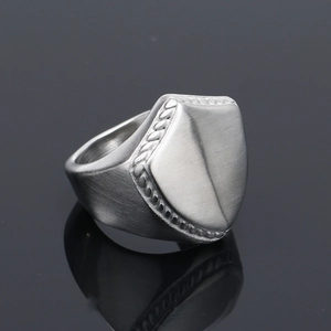 Minimalist punk titanium steel shield ring with brushed metal finish and woven texture