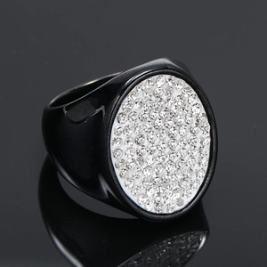 Macro shot of hip-hop signet ring with full pavé crystals on black stainless steel band