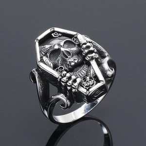 Detailed macro view of a vintage gothic coffin ring with an inner skull carving