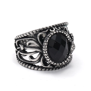 Retro men's titanium steel ring with hollow patterns and a large black faceted gemstone