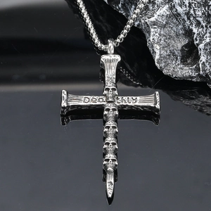 Gothic silver skull cross necklace with Deathly engraving on dark stone background