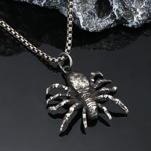 Macro shot of gothic spider pendant with vintage silver texture and durable box chain