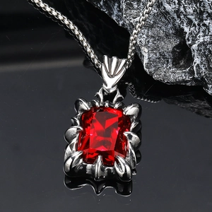 Gothic dragon claw necklace featuring a red rectangular gemstone on a silver beaded chain