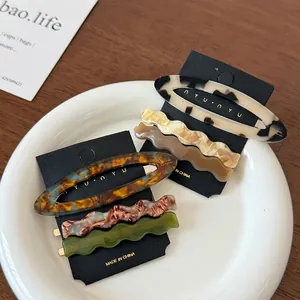 Set of 6 stylish acetate hair clips featuring wavy and oval tortoiseshell marble patterns