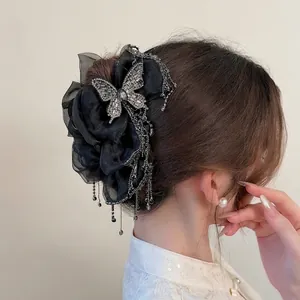 Elegant black organza bow hair clip with sparkling rhinestone butterfly and long tassels