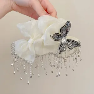Elegant cream organza bow hair claw clip with diamond butterfly and long metal tassels