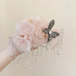 Detailed pink organza bow hair claw with sparkling butterfly and long rhinestone tassels