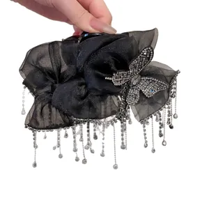 Elegant black organza bow hair claw clip with rhinestone butterfly and long tassels