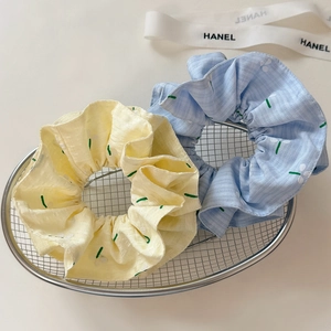 Floral embroidery scrunchies set in yellow and blue colors for elegant hair styling
