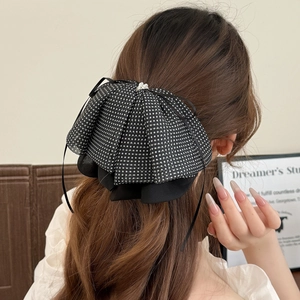 Elegant oversized black polka dot mesh bow hair clip with pearls for long hair