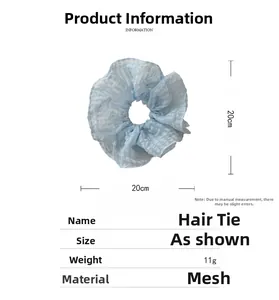 Détails du chouchou en maille bleu clair de 20cm avec les dimensions et le poids