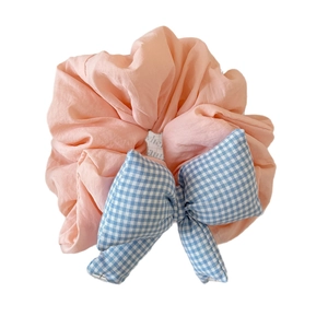 Pink scrunchie with blue plaid bow tie design and pleated ruffles for women hair