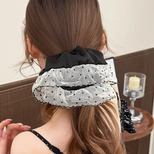 Polka dot mesh scrunchie with layered black and white lace for elegant ponytails