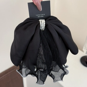 Elegant black mesh bow hair claw clip with faux pearls for a sophisticated women's hairstyle