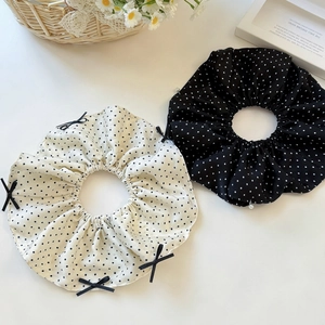Elegant polka dot scrunchie set with bow and pearl detail for stylish hair updos