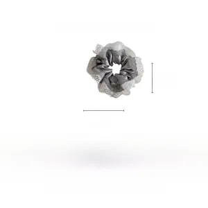 Detail showing 12cm grey satin scrunchie with white lace edge and technical dimensions