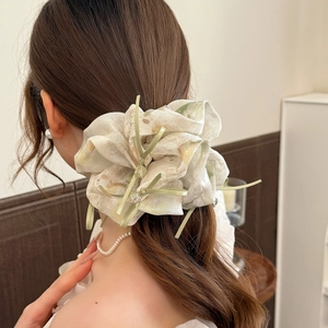Floral organza hair scrunchie with pastel flower patterns and delicate ribbon details