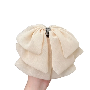 Elegant beige chiffon layered butterfly hair clip with sparkling black rhinestones