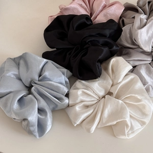 Five-piece set of glossy satin scrunchies in pastel colors for elegant hair styling