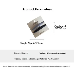 Detail view of denim blue and grey shuttle-shaped hair clips with size dimensions on card
