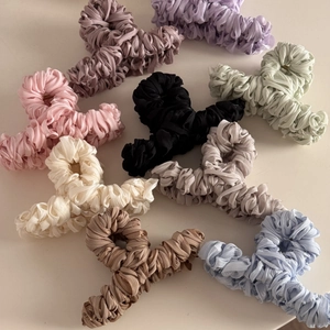 Silk pleated fabric wrapped claw clips in eight pastel colors for elegant hair styling