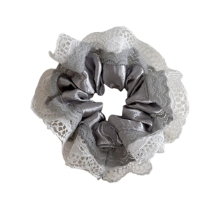 Elegant silver satin scrunchie with white lace trim and vintage glossy silk texture