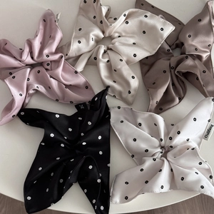 Five assorted satin floral scrunchies with streamers in pink, beige, and black colors